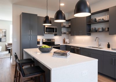 A complete kitchen optimization designed for contemporary living. This project features premium custom dark gray cabinetry with minimalist hardware, seamless quartz countertops, integrated professional appliances, and strategic ambient under-cabinet lighting. Built on precision, delivered with zero budget surprises.